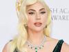 Gaga stuns in plunging gown on red carpet