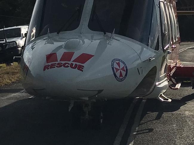 The Westpac Life Saver Rescue Helicopter at the scene of a crash at Clothiers Creek.