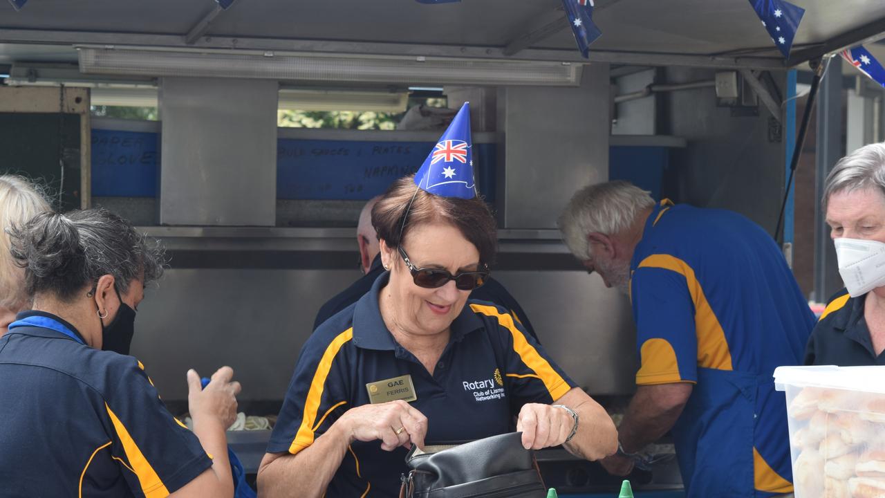 Gae Ferris from the Lismore Rotary Club prepares to serve the new Australian citizens a barbecue at the Australia Day citizenship ceremony at Lismore City Hall January 26 2022. Photo Nicholas Rupolo