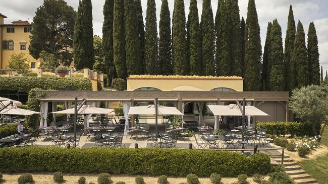 Dining area backed by Cyprus pines.