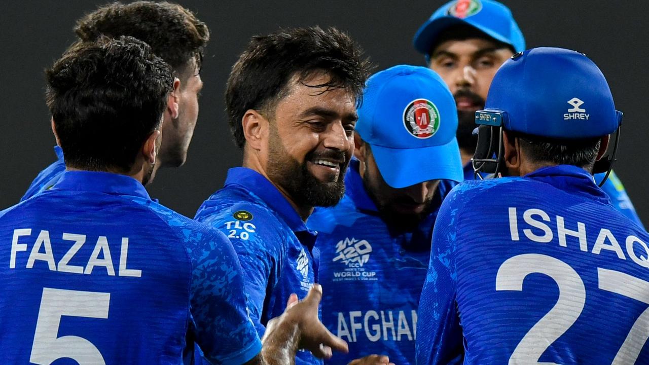 Afghanistan men’s captain Rashid Khan (centre) says Cricket Australia should not punish the men’s cricket team for a decision ‘not under the control of anyone in cricket’ to abolish the women’s side. Picture: Randy Brooks / AFP