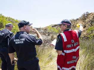 Fire investigators at the scene near the ignition point of Wednesday's Peregian Beach bushfire. Photo: Lachie Millard