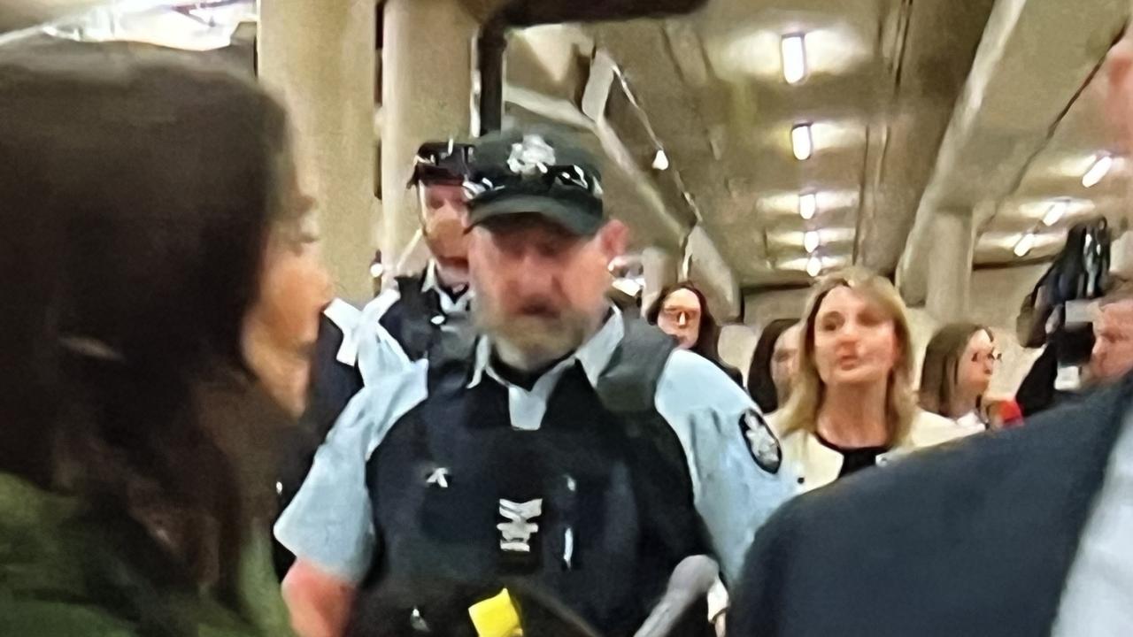 Flanked by the Australian Federal Police, an embattled Optus boss refused to answer media questions as she fled Parliament after a two-hour grilling. Picture: SkyNews