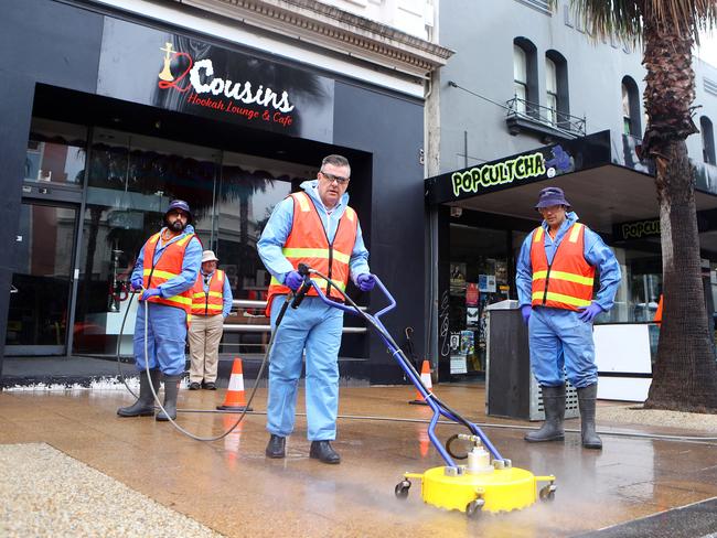 Taking it to the streets: Cr Anthony Aitken and members of the CityÕs street cleaning crew  disinfecting and street cleaning. Picture: Alison Wynd