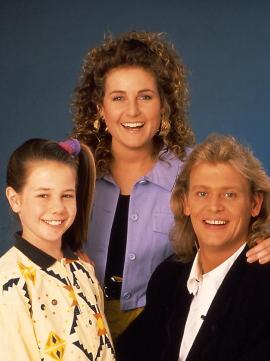 John Farnham with Kate Ritchie and Sharyn Hodgson on Home and Away in 1988.