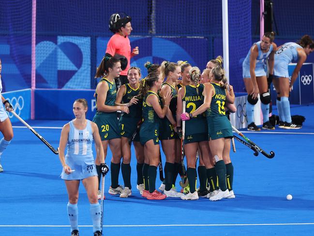 Australia celebrate one of their goals against Argentina. Picture: Alex Pantling/Getty Images