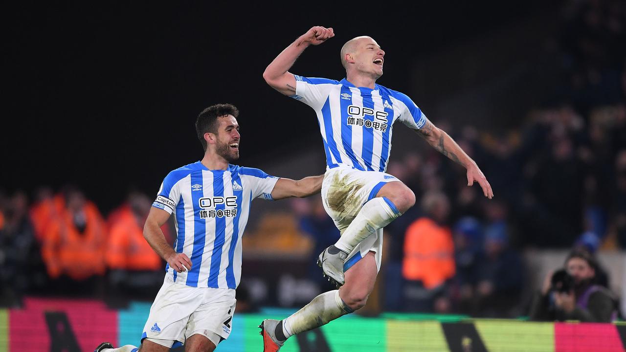 Aaron Mooy of Huddersfield celebrates after scoring