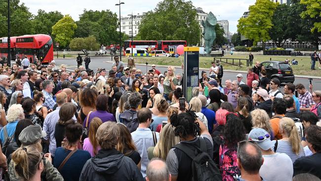 People gather to listen to speakers at a protest organised by "Keep Britain Free" in London over the government's decision to impose mask wearing for shoppers. Picture: AFP.