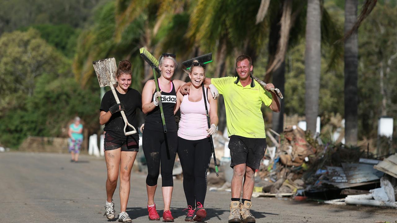 Mud Army volunteers Aleesha Kennedy, 15, Lauren Wilson, Shaelan Smith and Shane Short ready for work in 2013 with shovels and brooms.