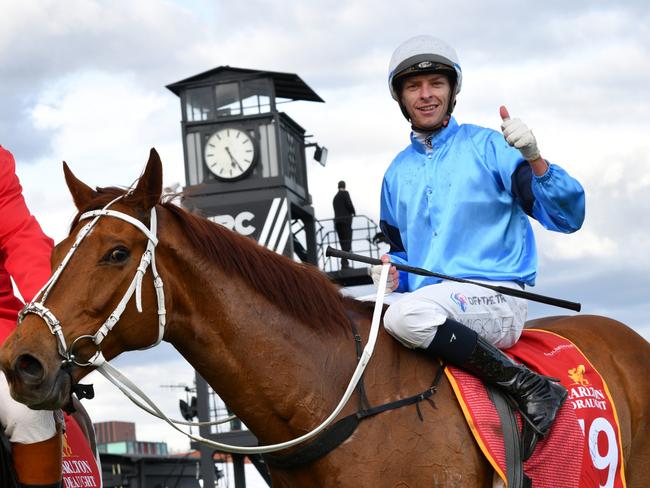 MELBOURNE, AUSTRALIA - OCTOBER 15: Michael Dee riding Durston after winning Race 9, the Carlton Draught Caulfield Cup, during Caulfield Cup Day at Caulfield Racecourse on October 15, 2022 in Melbourne, Australia. (Photo by Vince Caligiuri/Getty Images)