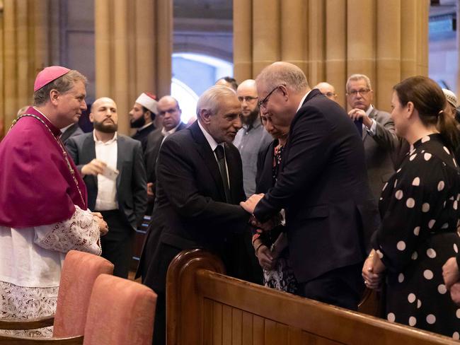 Australia Prime Minister Scott Morrison receives Australia's grand mufti Ibrahim Abu Mohammed at an interfaith service at St Mary’s Cathedral in Sydney. Picture: AFP