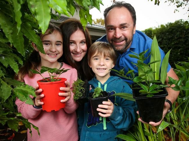 Julia and Jason Kloszynski, with their two children Zara, 10 and Ryan, 8, are saving hundreds of dollars a week during the COVID-19 lockdown period. Picture: Ian Currie