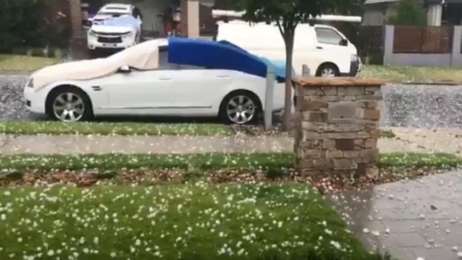 A car surrounded by hail at Oran Park. Picture: Twitter/Emma Smidt