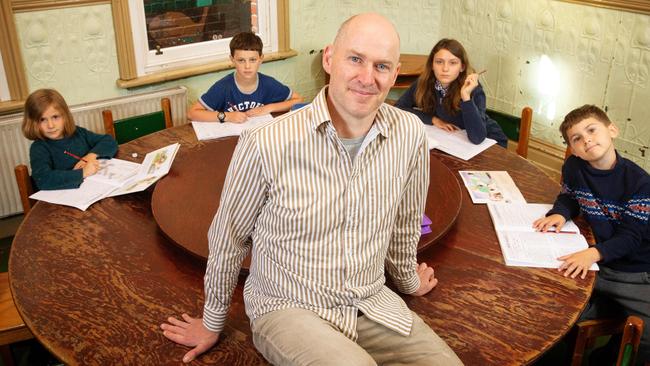 Fitzroy Community School principal Tim Berryman with Abigaelle, 6, Christian, 10, Charlotte, 12, and Xavier, 8. Picture: Mark Stewart