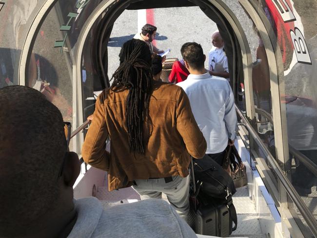 Passengers leave an Emirates aeroplane at New York's Kennedy Airport. Picture: AP