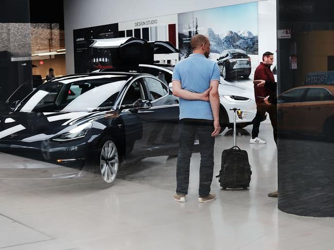 Tesla cars displayed at a New York showroom earlier this week. Tesla stock rose this week after the company revealed it is nearing its Model 3 weekly production rate. Also, in a vote shareholders backed Elon Musk as chairman and CEO. Picture: Spencer Platt/Getty Images