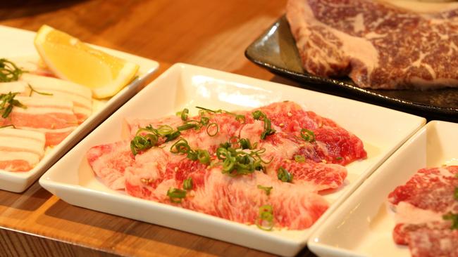 Customers choose their preferred type of meat then cook it to their liking. Picture: Hamish Blair