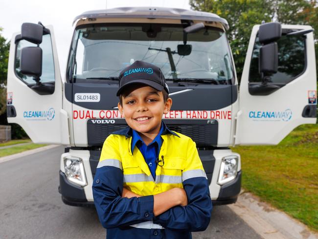 Ethan Nilsen  in front of the garbage truck