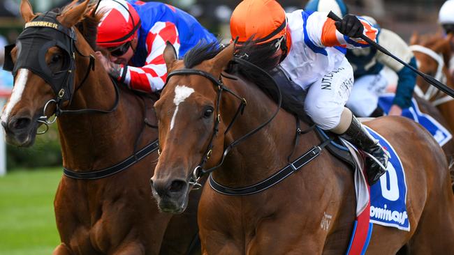 Barend Vorster rides Secret Blaze (right) to victory at Moonee Valley.