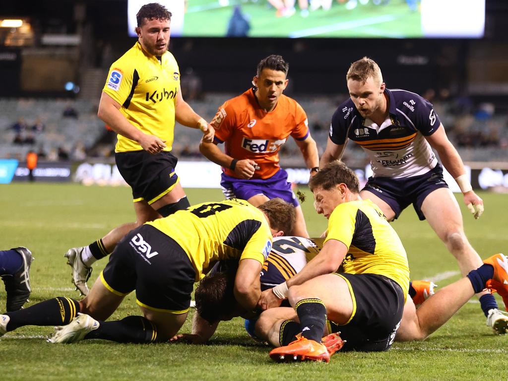 Brumbies hooker Billy Pollard fights his way over for a try. Picture: Getty Images