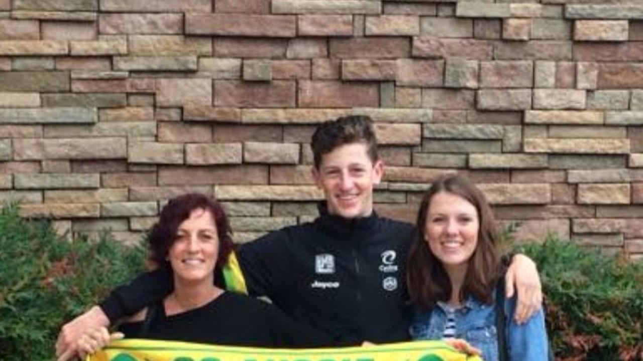 Warwick-born athlete Harry Sweeny (centre) with mum Kristy and sister Georgia before competing in his first World Championships in Richmond.