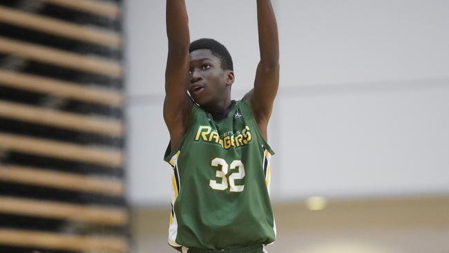 John Efunkanbi puts up a shot for Dandenong. Picture: Valeriu Campan