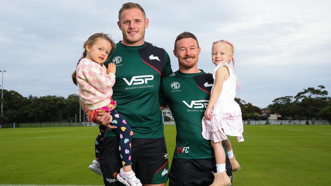 Thomas Burgess and Damien Cook with their daughters. Picture: Gaye Gerard