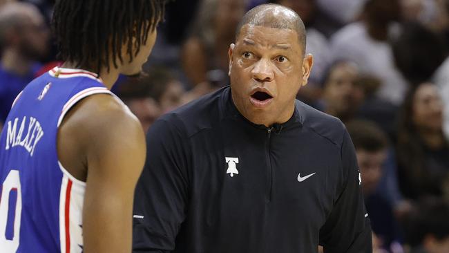 PHILADELPHIA, PENNSYLVANIA - APRIL 16: Head coach Doc Rivers speaks with Tyrese Maxey #0 of the Philadelphia 76ers during the third quarter against the Toronto Raptors during Game One of the Eastern Conference First Round at Wells Fargo Center on April 16, 2022 in Philadelphia, Pennsylvania. NOTE TO USER: User expressly acknowledges and agrees that, by downloading and or using this photograph, User is consenting to the terms and conditions of the Getty Images License Agreement.   Tim Nwachukwu/Getty Images/AFP == FOR NEWSPAPERS, INTERNET, TELCOS & TELEVISION USE ONLY ==