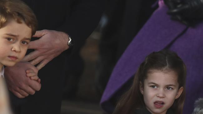 Prince George and Princess Charlotte arrive at St Mary Magdalene Church. Picture: AP.