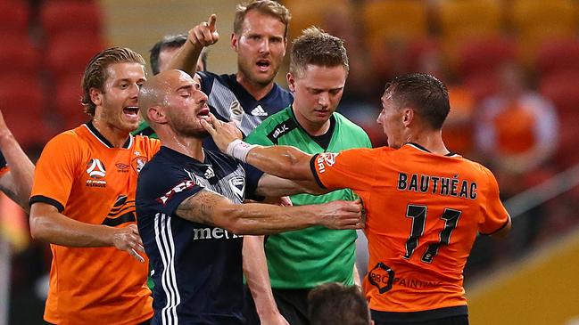 Melbourne’s James Troisi gets involved in an altercation with Brisbane’s Eric Bautheac which led to the Roar player being sent off at Suncorp Stadium. Picture: AAP