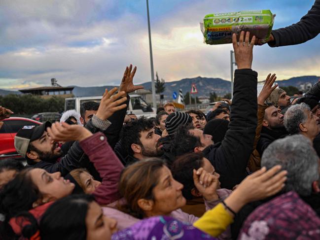 Survivors gather to collect nappies and baby goods in Hatay, Turkey. Picture: AFP