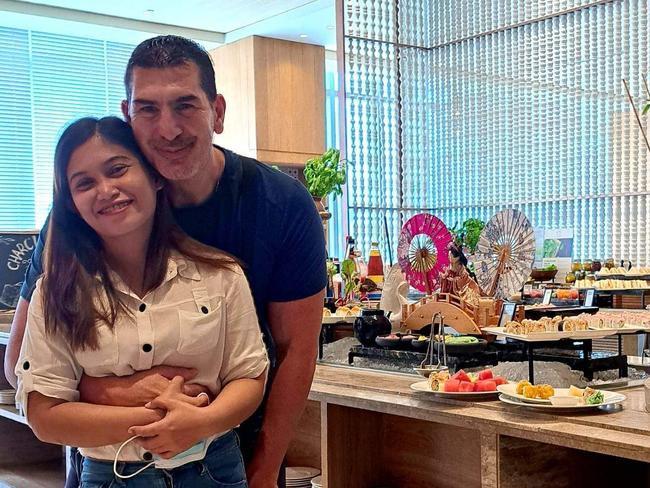 Liezl Rubillos is unable to be with John Totsis during his recovery as she waits for her visa in the Phillipines.