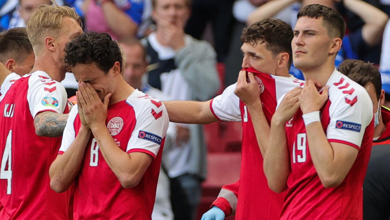 Denmark players were in shock after Christian Eriksen collapsed on-field. (Photo by Friedemann Vogel / POOL / AFP)