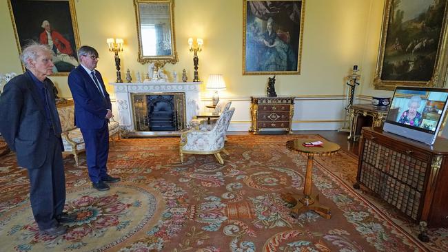 David Constantine (left), accompanied by Poet Laureate Simon Armitage as The Queen presents her Gold Medal for Poetry at Buckingham Palace. Picture: Kirsty O'Connor – Pool/Getty Images.