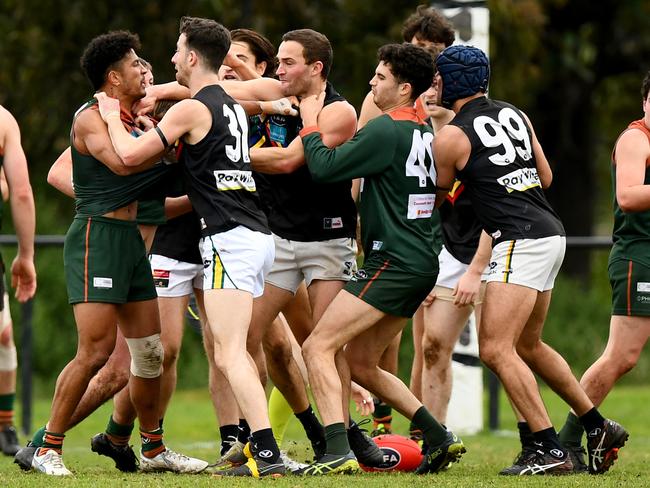 Players wrestle during the 2023 round 17 Victorian Amateur Football Association Division 1 Men's match between University High School - Victoria University Amateur Football Club and Glen Eira at Brens Oval in Parkville, Victoria on August 19, 2023. (Photo by Josh Chadwick)