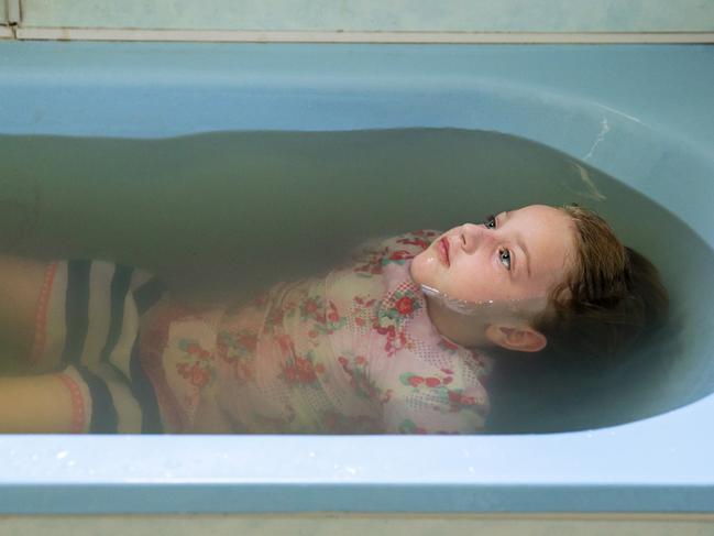 Talita in the same bath filled with tap water from the Darling River this week. Picture: Jenny Evans