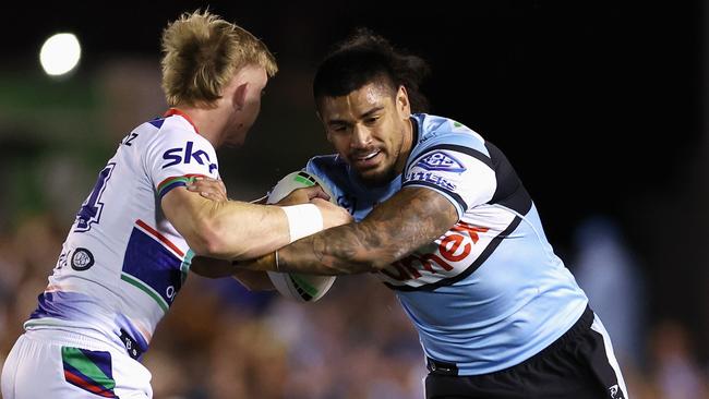 SYDNEY, AUSTRALIA - AUGUST 31: Oregon Kaufusi of the Sharks is tackled during the round 26 NRL match between Cronulla Sharks and New Zealand Warriors at PointsBet Stadium, on August 31, 2024, in Sydney, Australia. (Photo by Cameron Spencer/Getty Images)