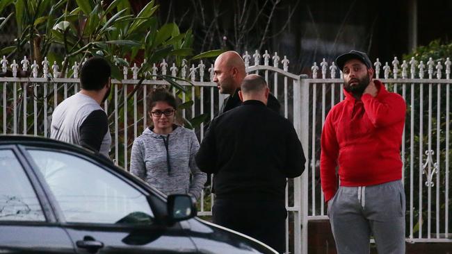 Family and friends of the Ghanem family gather after news of the death of their baby son John.