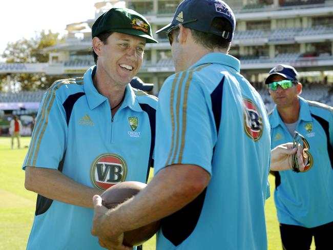 Bryce McGain gets a handshake from Mike Hussey after receiving his baggy green.