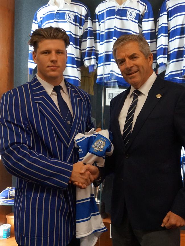Nudgee College captain and prop Harrison Vella presented with his First XV jersey by principal Peter Fullagar. Picture: Nudgee College
