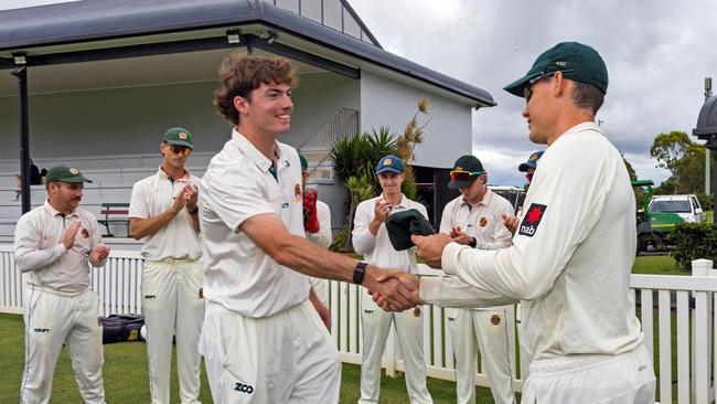 Sam Heazlett presenting Redlands young gun Lachlan McClure his Tigers baggy green earlier this year when making his first grade debut.