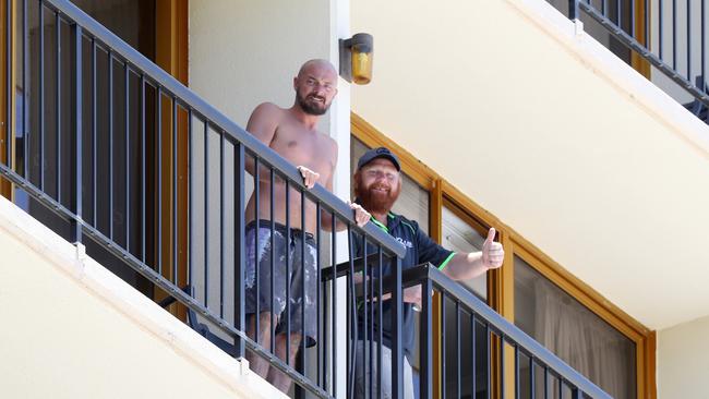 People in quarantine on the balconies at Pacific Hotel in Cairns. Picture: Stewart McLean