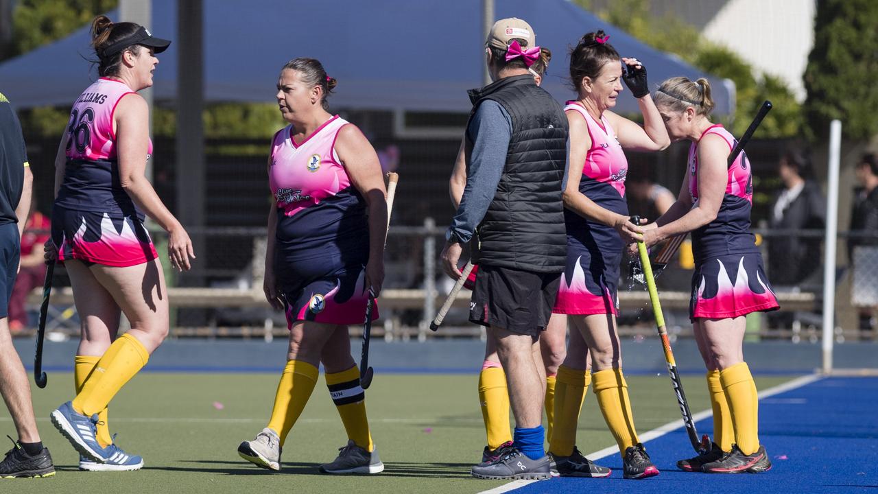 Toowoomba 2 player Rachael Williams (left) and captain Allison Campbell (centre) during a break against Maryborough 1.