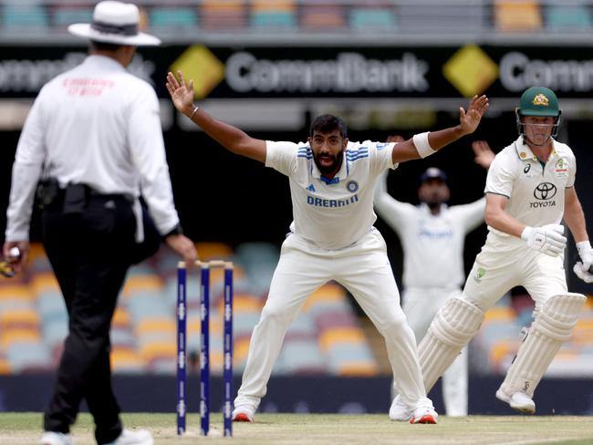 TOPSHOT - Indiaâs Jasprit Bumrah (C) appeals unsuccessfully for LBW for Australiaâs Nathan McSweeney (R) on day five of the third cricket Test match between Australia and India at The Gabba in Brisbane on December 18, 2024. (Photo by DAVID GRAY / AFP) / -- IMAGE RESTRICTED TO EDITORIAL USE - STRICTLY NO COMMERCIAL USE --