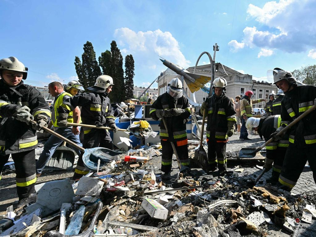 Firefighters take rubble out of a damaged building following a Russian air strike in the city of Vinnytsia, west-central Ukraine, on July 14, 2022. Picture: Sergei Supinsky / AFP.
