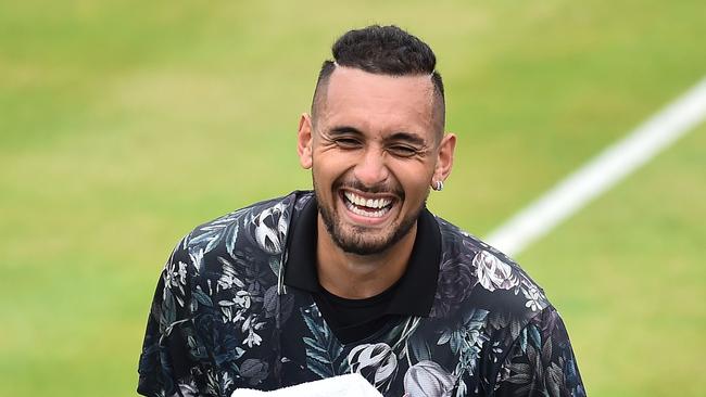 Australia's Nick Kyrgios reacts against Spain's Roberto Carballes Baena during their men's singles round of 32 tennis match at the ATP Fever-Tree Championships tournament at Queen's Club in west London on June 20, 2019. (Photo by Glyn KIRK / AFP)