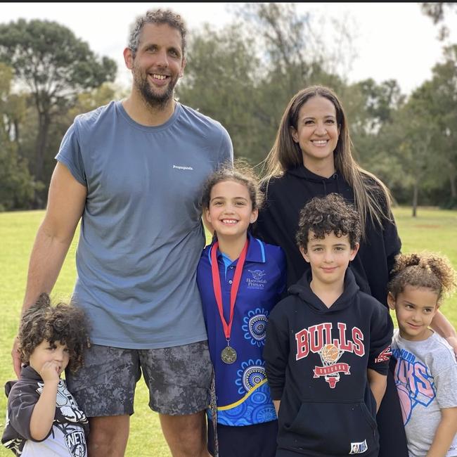 Three-time NBL champion Matt Knight with his four kids and wife. Knight suffered 15 concussions during his 10-year career and he wants the NBL to strengthen its concussion protocols.