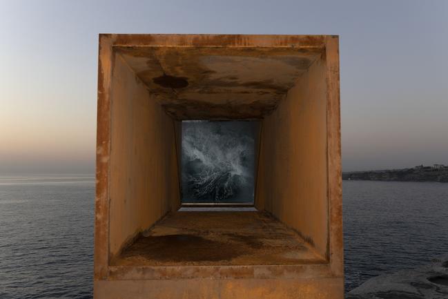 Joel Adler’s Viewfinder, giving visitors a normally hidden view of the surging ocean and rocks below, is already a popular work in Sculpture by the Sea. Picture: Brook Mitchell/Getty Images