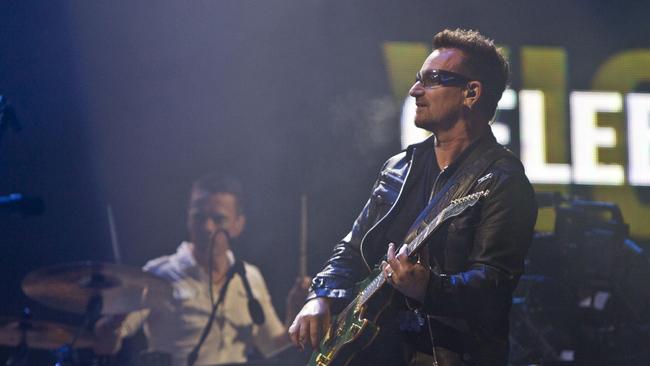 Bono and U2 performing at Glastonbury Music Festival