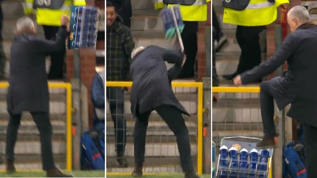 Jose Mourinho takes it out on the water bottles.